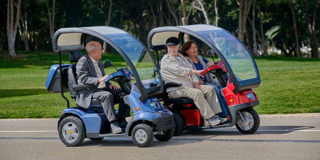 Two heavy duty mobility scooters side by side