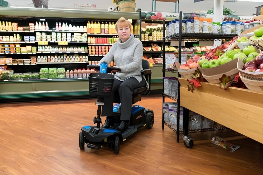 Standard mobility scooter being used in a supermarket