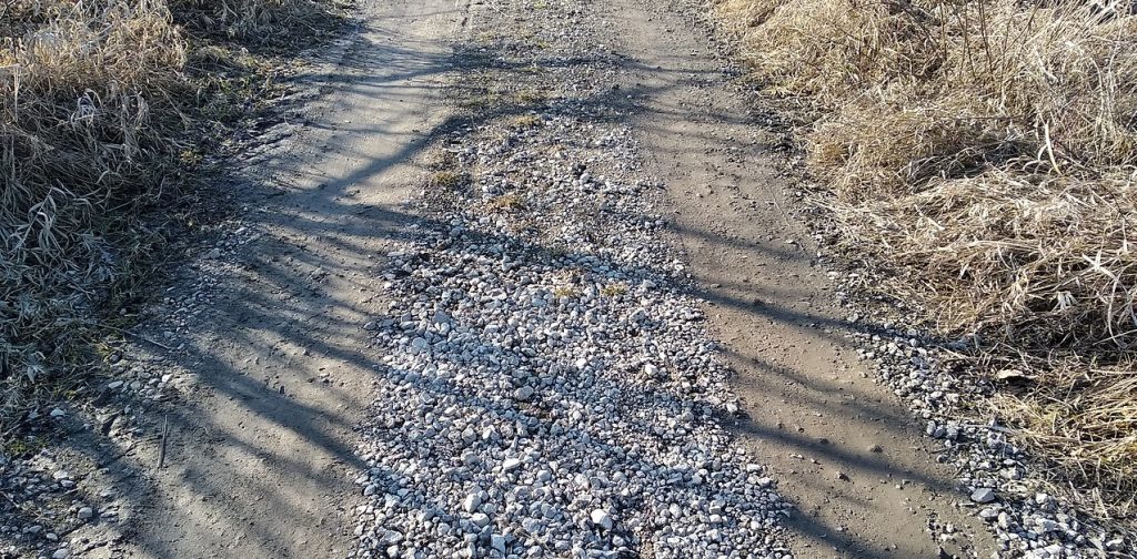 Loose gravel and soil surface