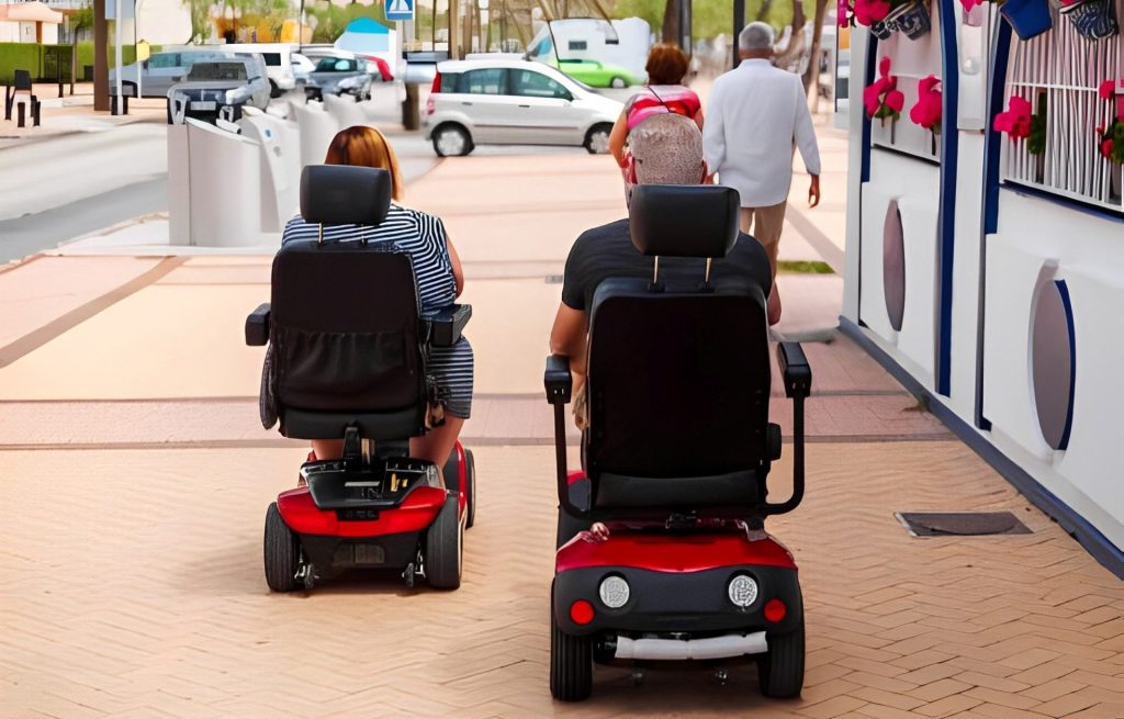 Mobility scooters lined up and ready for outdoor use
