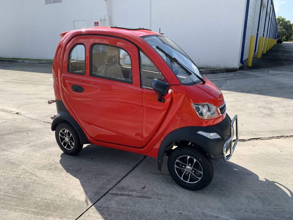 Red Q Runner enclosed mobility scooter in use in California