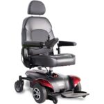 Front side view of the Merits Vision CF wheelchair, showing its sleek design, supportive seating, and durable wheels,...