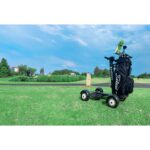 Right side quarter view of the Golf Skate Caddy GSC™ Tourer X Golf Cart Mobility Scooter captured on a golf course, providing a detailed perspective of its features against the backdrop of lush greens.