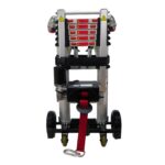 Rear view of the Enhance Mobility Hercules portable lift, showing the winch mechanism with red safety straps and a warning label array, mounted on a compact base with small wheels