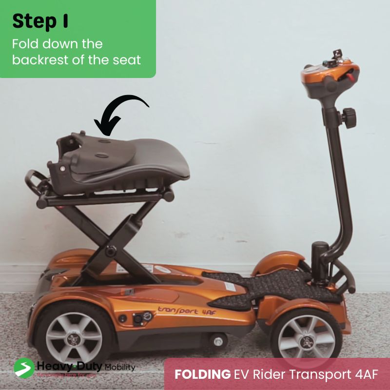 Folding down the EV Rider Transport 4AF scooter seat.