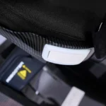 Close-up of side release latch for folding the seat of the Golden Technologies Ally Sport GP305 power chair.