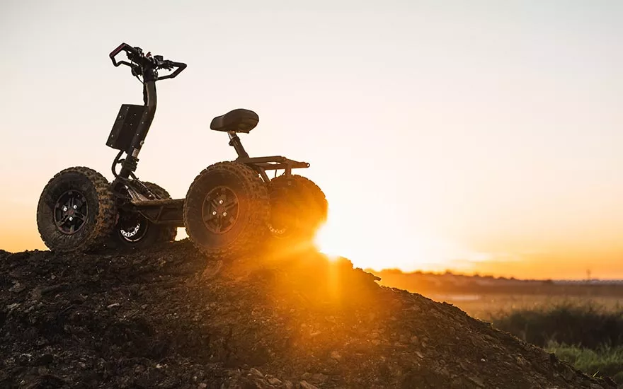 EZRaider HD4 4x4 off-road electric scooter shown from the side in a studio gallery photo