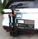 Model 101 Electric Tilt n Tote with folded wheelchair secured on platform