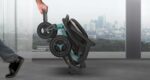 Folded Robooter E40 tilted and pulled by one hand like a trolley