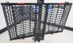 Angled view of the US208 lift showing reflective markers and retractable ratchet tie downs